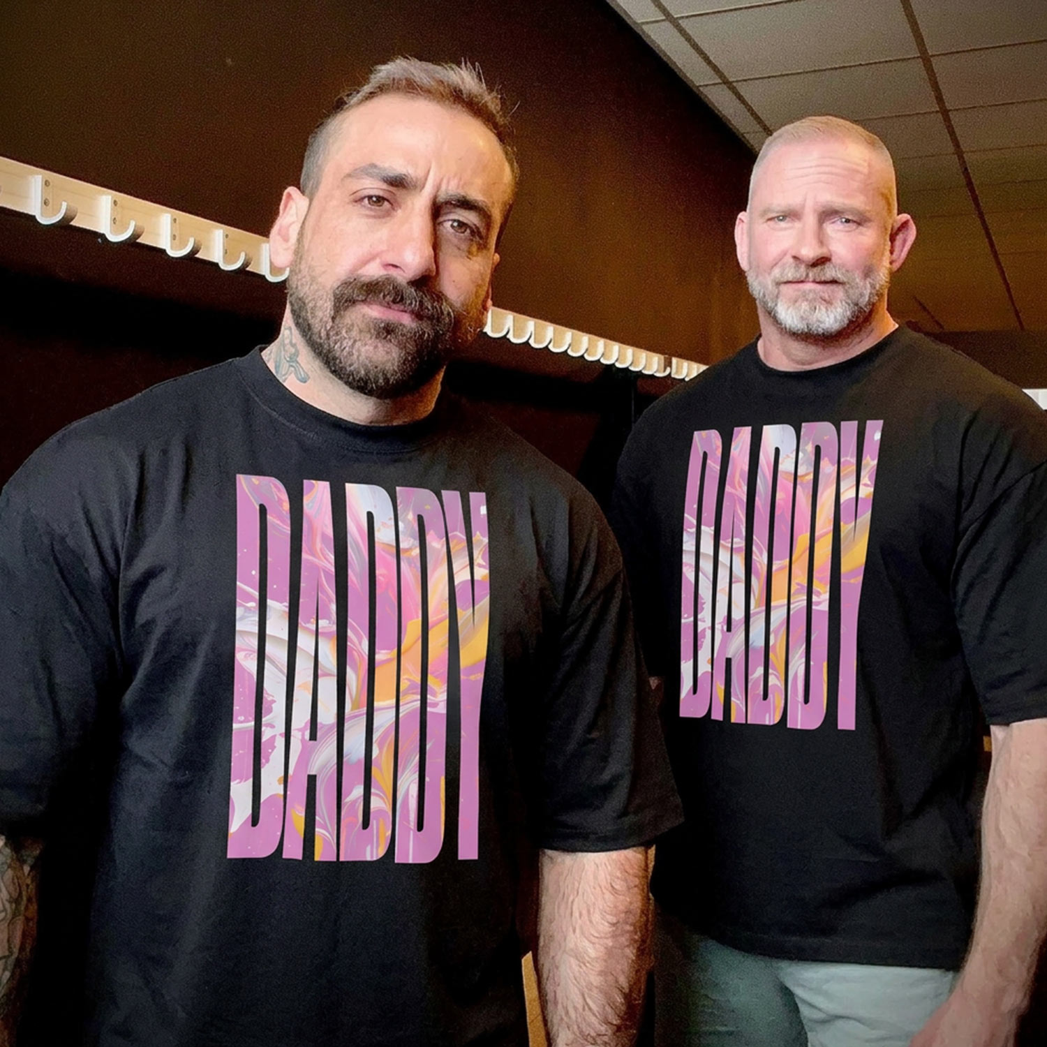 Folded black Gayer Things Daddy oversized tee flat lay — typography and fabric detail