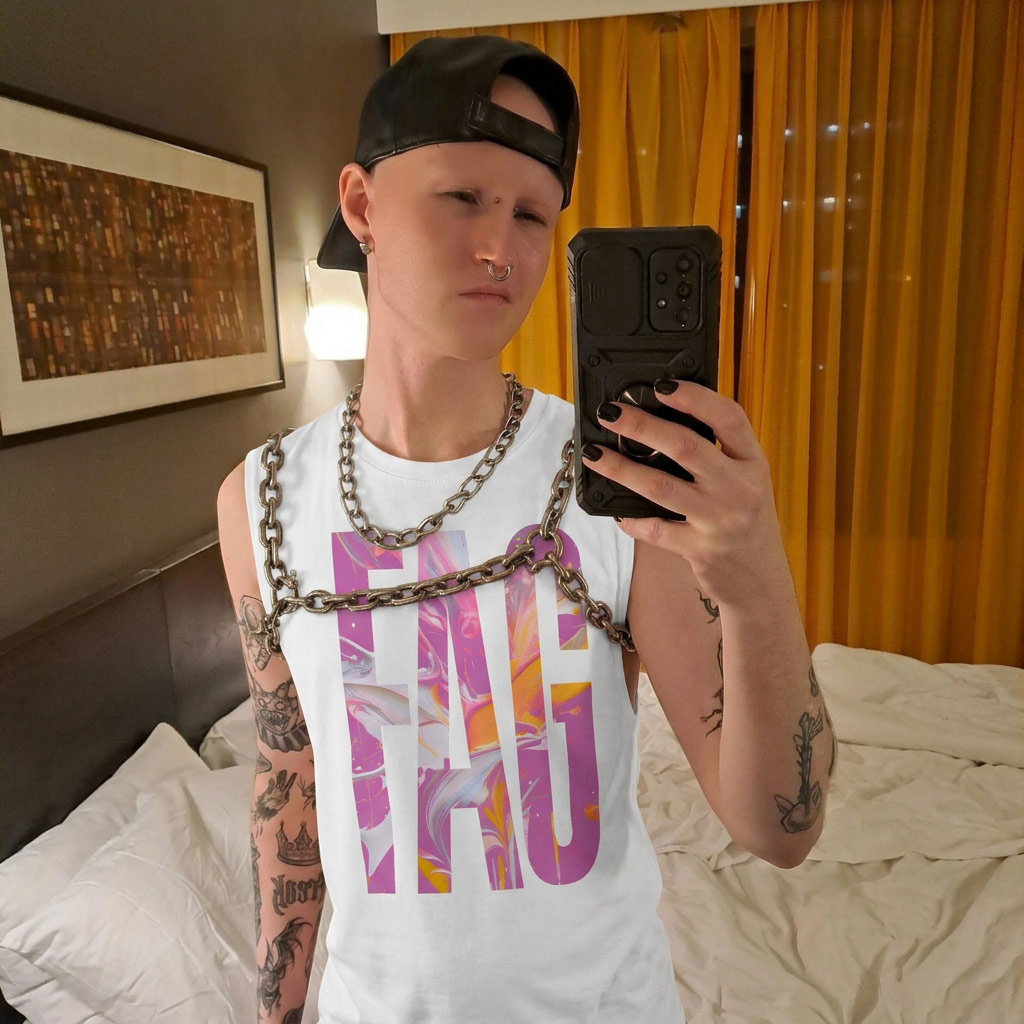 Model in white Gayer Things muscle tee with crossed arms — marble swirl typography detail