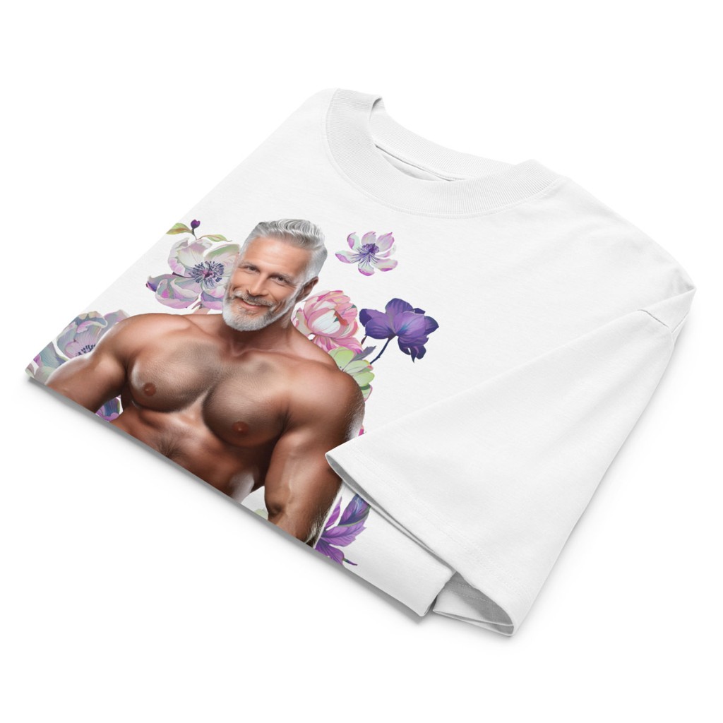 Folded white Himbo Dan oversized organic cotton tee flat lay — watercolor florals and ribbed collar detail