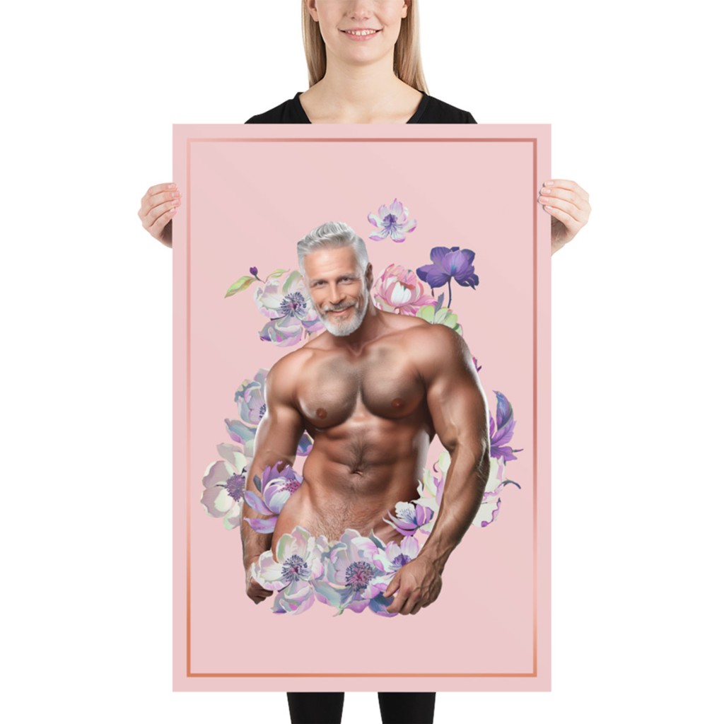 Person holding Himbo Dan vertical photo poster — silver-fox smile, lavender florals on pink, thin rose-gold border, white studio backdrop