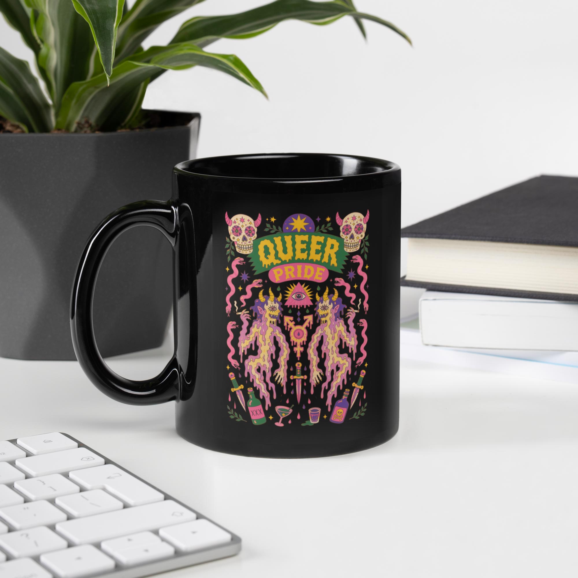 Black Gayer Things Queer Pride ceramic mug on wood surface — lifestyle product photo