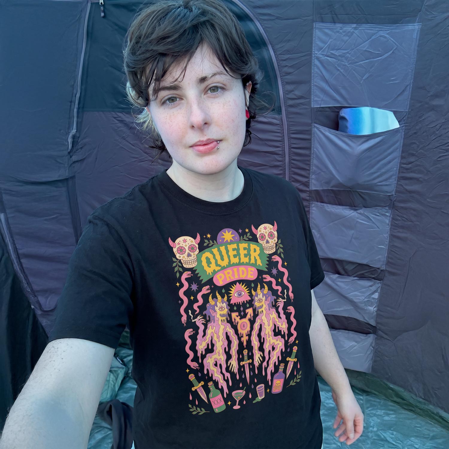 Model in black Gayer Things Queer Pride oversized T-shirt — lifestyle streetwear angle